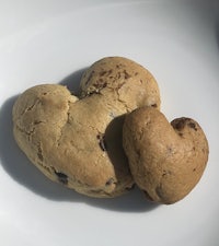 two cookies in the shape of a heart on a plate